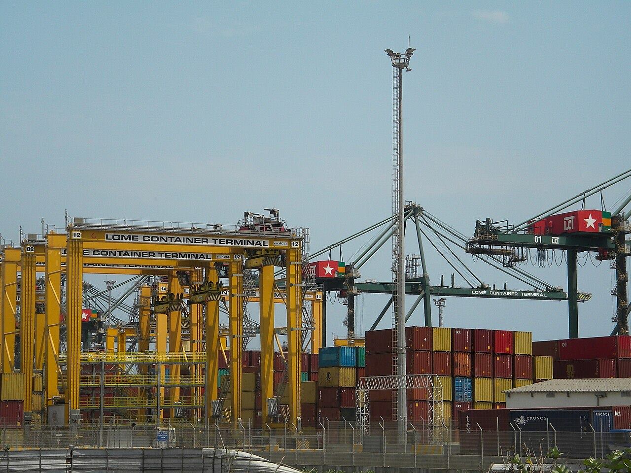 Container cranes and cargo stacks at Lomé Container Terminal in West Africa